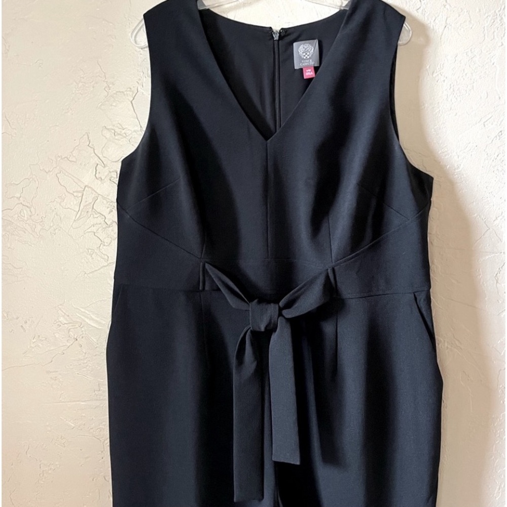 Chic black jumpsuit. Tie waist adds  to the shape to create a flattering fit.